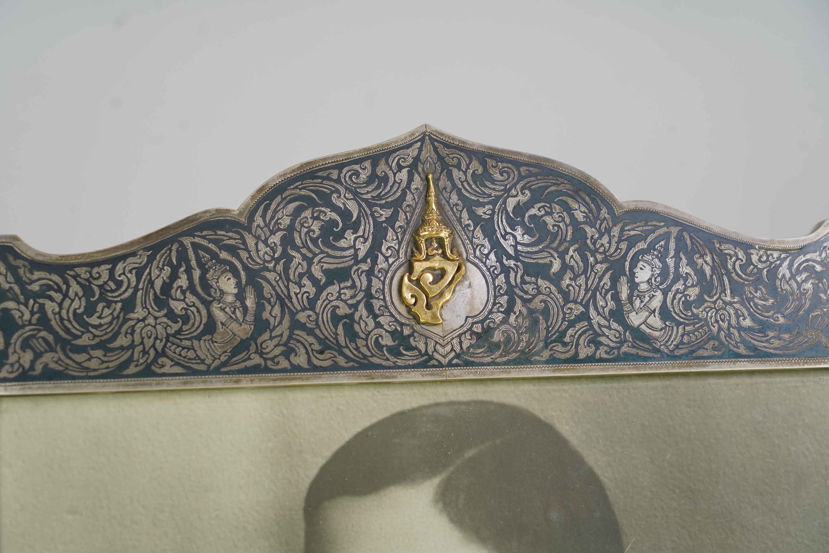 A large early 20th century Siamese silver and niello mounted rectangular photograph frame
